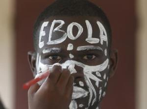 An actor prepares before a performance during an awareness campaign against Ebola at Anono school in Abidjan